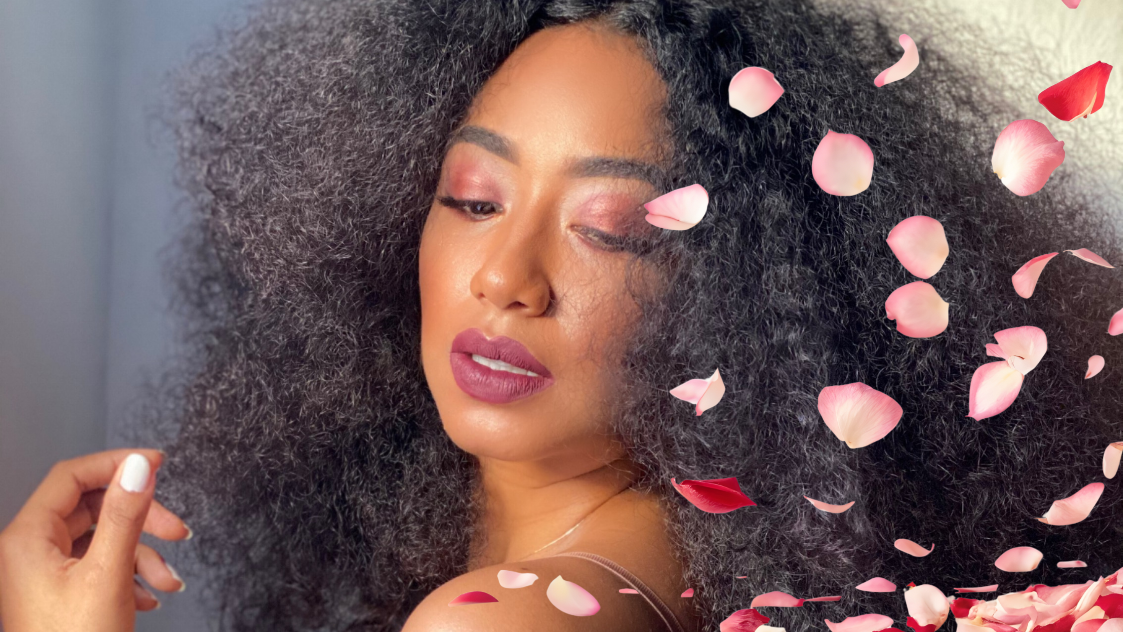 Woman with big hair and pink and red roses